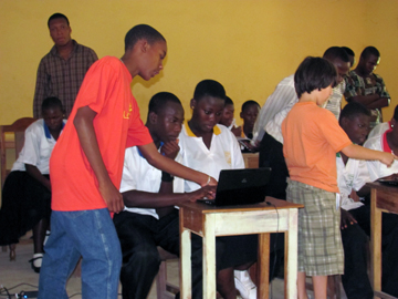 Marcel Bennett and Isaac Eglash helping students at Ayeduase jr high school