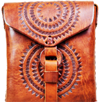 A Mexican leather bag with a sun based design.